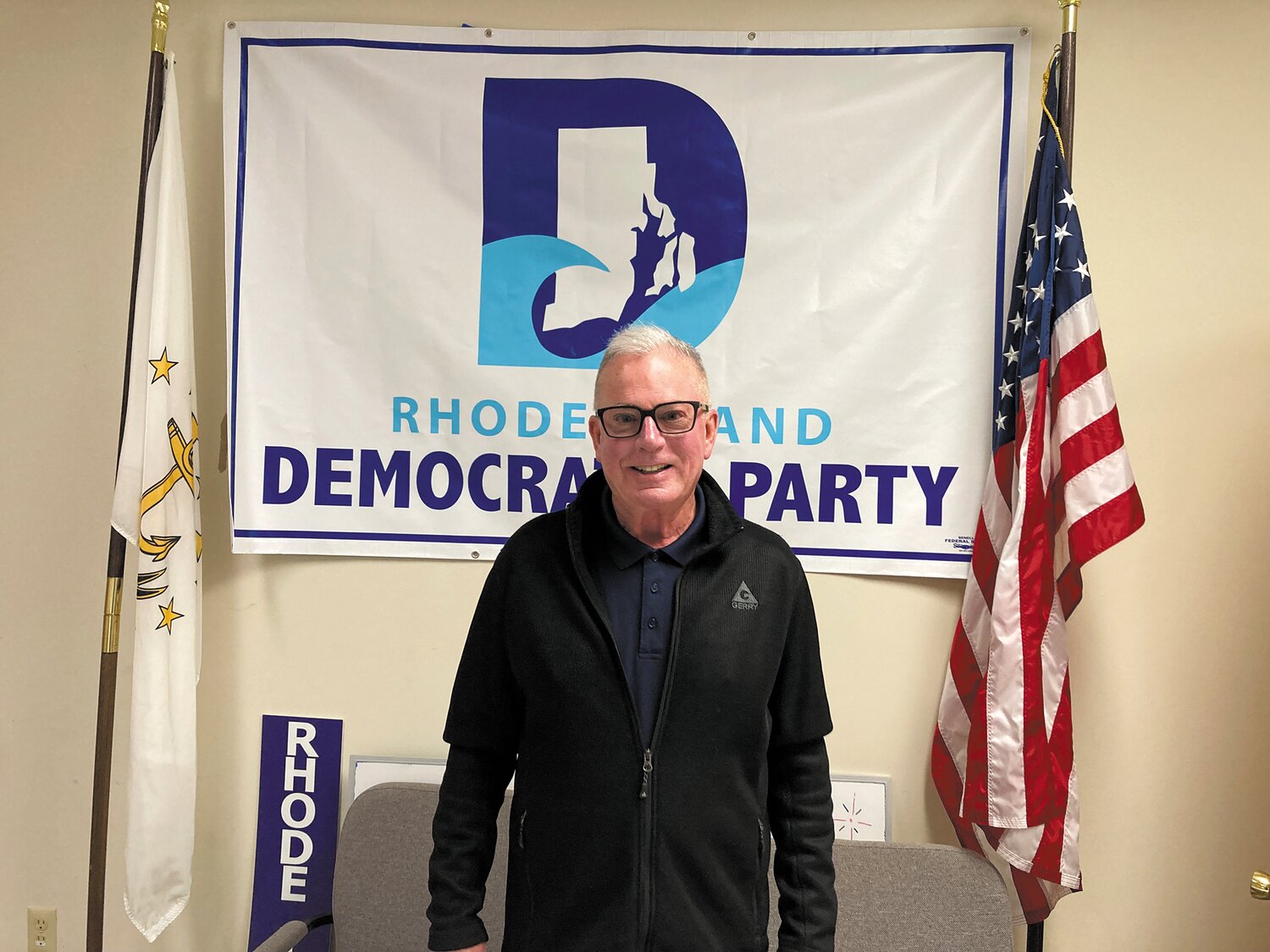 A PARTY MAN: McNamara stands in the Rhode Island Democratic Party’s Warwick office, which still bore signs of celebration from Gabe Amo’s victory earlier that week.
